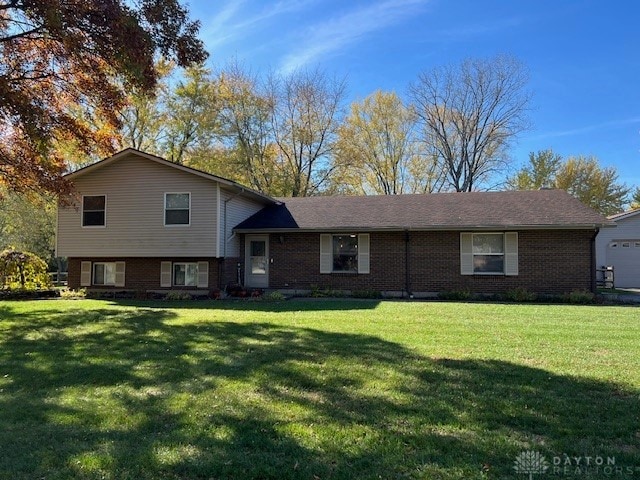 tri-level home with a front yard