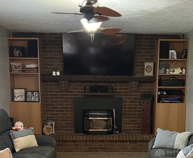 carpeted living room with ceiling fan and a textured ceiling