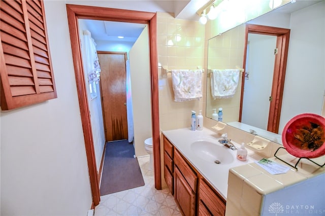 bathroom featuring vanity and toilet