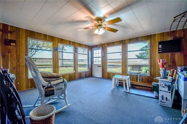 sunroom with ceiling fan