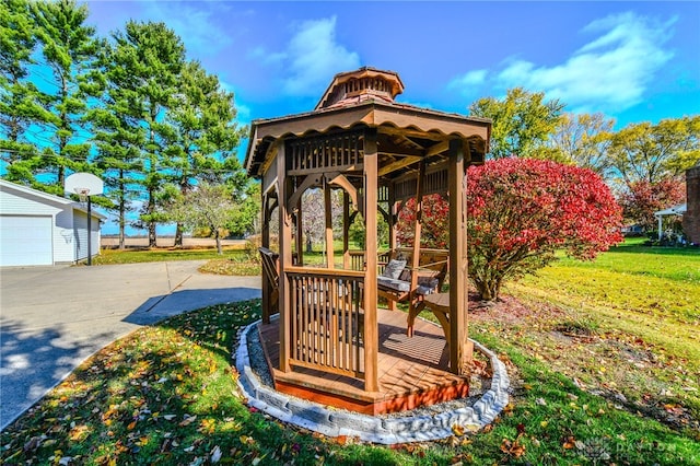 exterior space featuring a gazebo, a yard, and an outbuilding