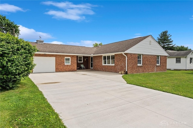 ranch-style home with a front lawn and a garage