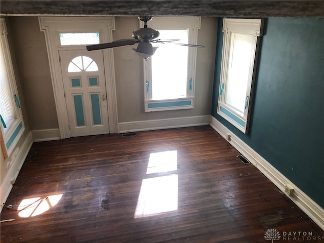 foyer with dark hardwood / wood-style floors and ceiling fan