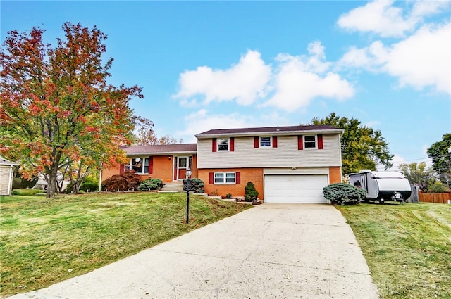 tri-level home with a front yard and a garage