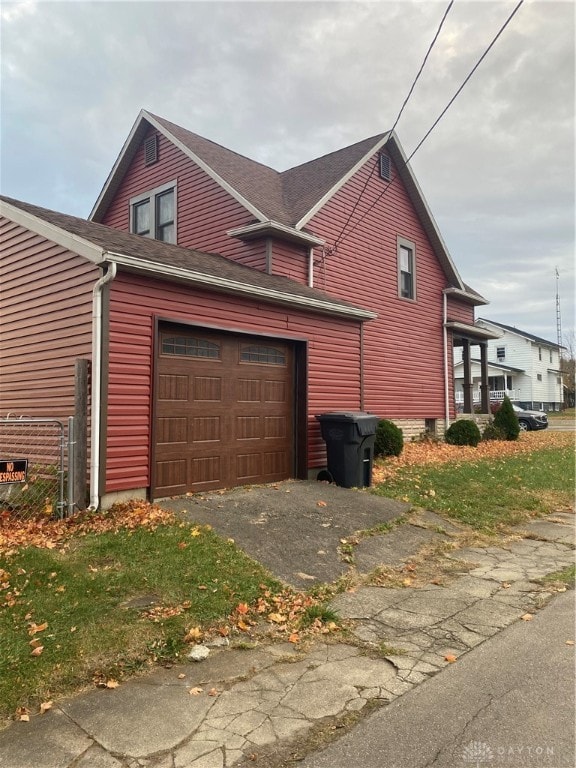 view of property exterior featuring a garage