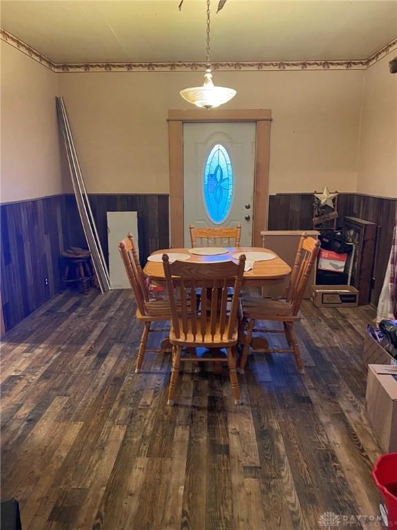 dining space featuring dark hardwood / wood-style floors