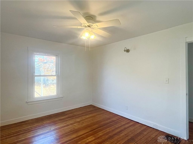 unfurnished room featuring ceiling fan and dark hardwood / wood-style flooring