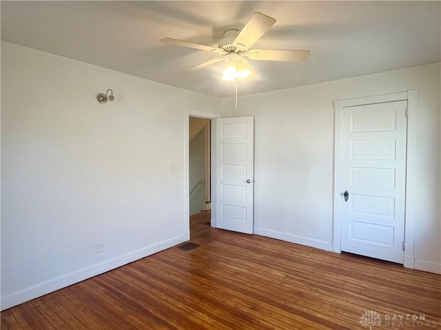 unfurnished bedroom featuring hardwood / wood-style floors and ceiling fan