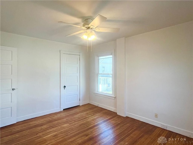 spare room with wood-type flooring and ceiling fan