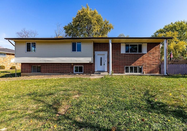 split foyer home with a front lawn