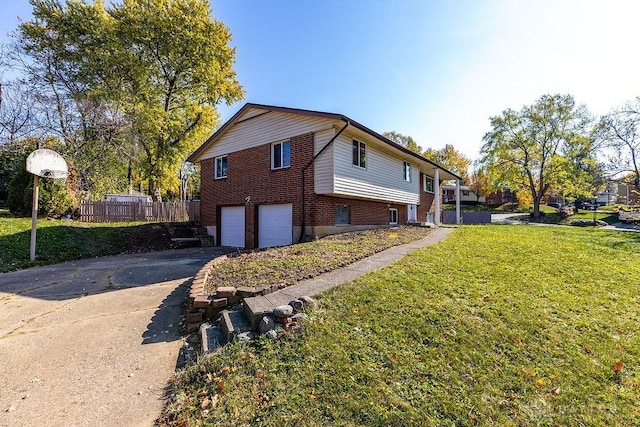 view of side of home with a garage and a yard