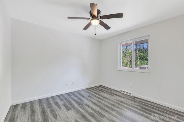 unfurnished room featuring hardwood / wood-style flooring