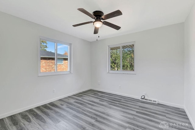 spare room with ceiling fan and hardwood / wood-style floors