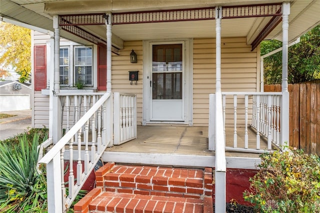 doorway to property featuring covered porch