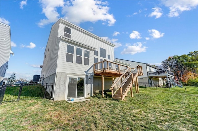 rear view of property featuring stairway and a deck