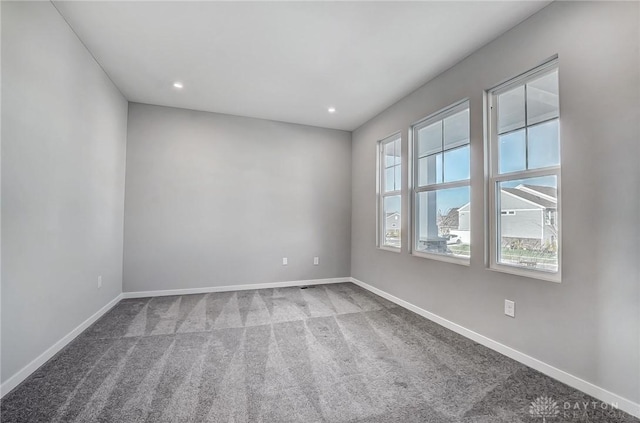 spare room with carpet, baseboards, and recessed lighting