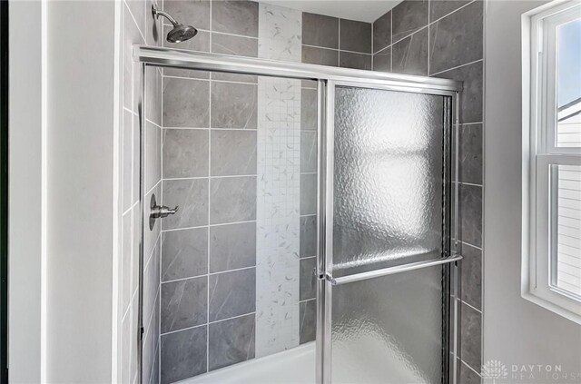 bathroom featuring a shower stall