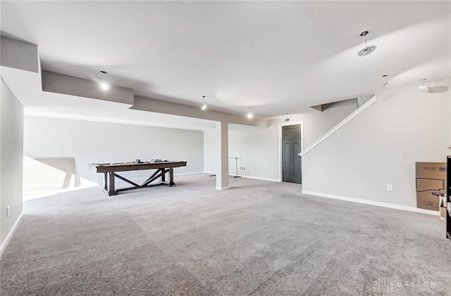 finished basement featuring carpet and baseboards