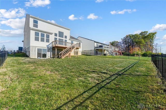 back of property with stairway and a wooden deck