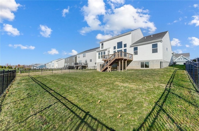 rear view of property with stairway and a wooden deck