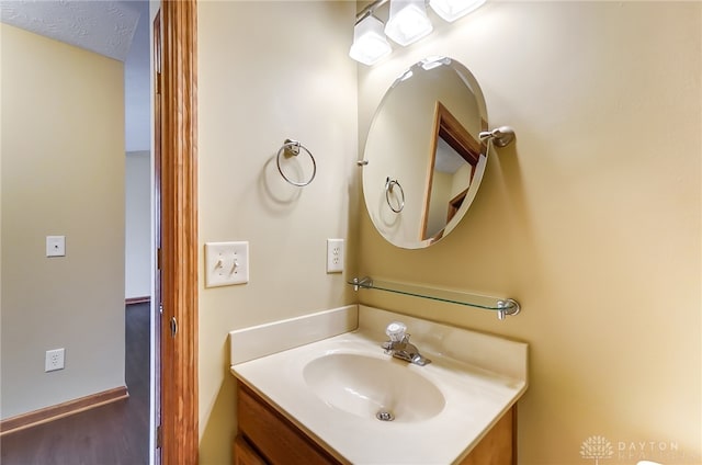 bathroom with vanity and a textured ceiling