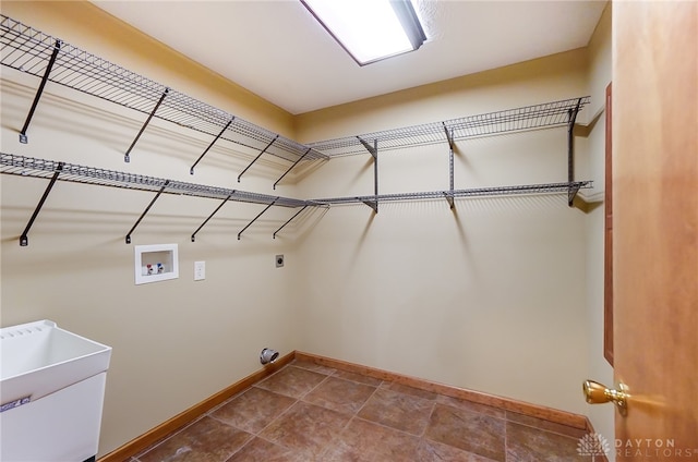 laundry area featuring hookup for an electric dryer, washer hookup, and sink