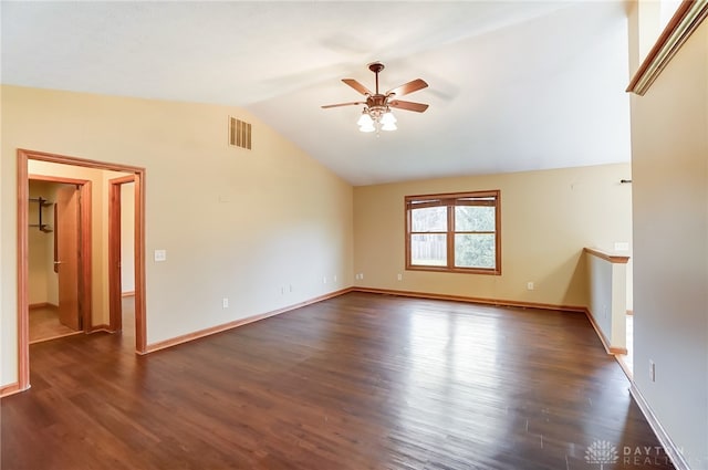 spare room with ceiling fan, lofted ceiling, and dark hardwood / wood-style flooring