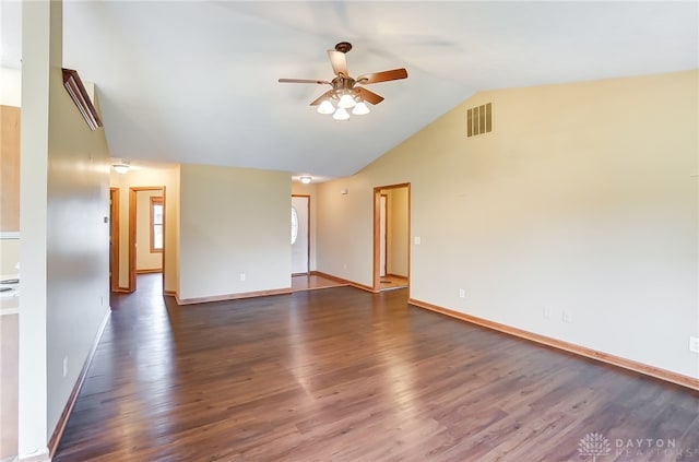 empty room with lofted ceiling, ceiling fan, and dark hardwood / wood-style floors