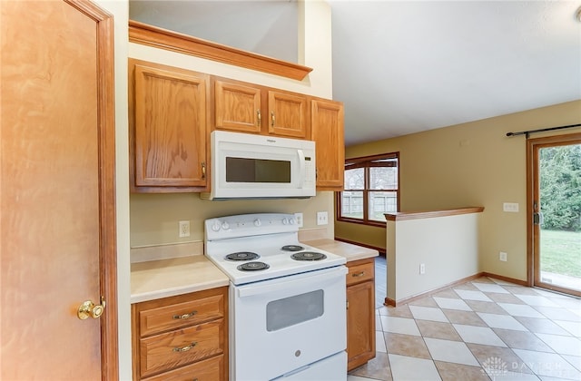 kitchen with white appliances and plenty of natural light