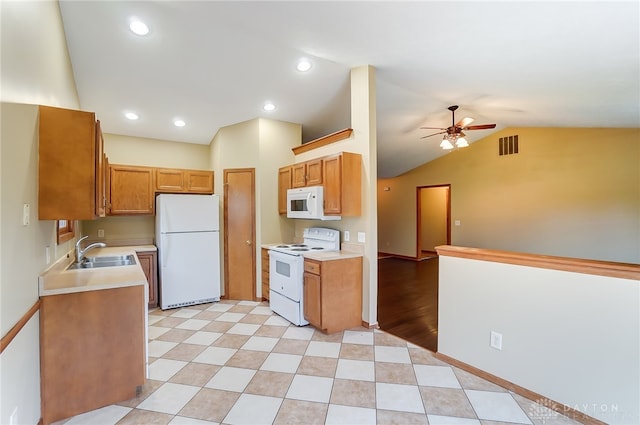 kitchen with white appliances, ceiling fan, sink, light hardwood / wood-style floors, and lofted ceiling