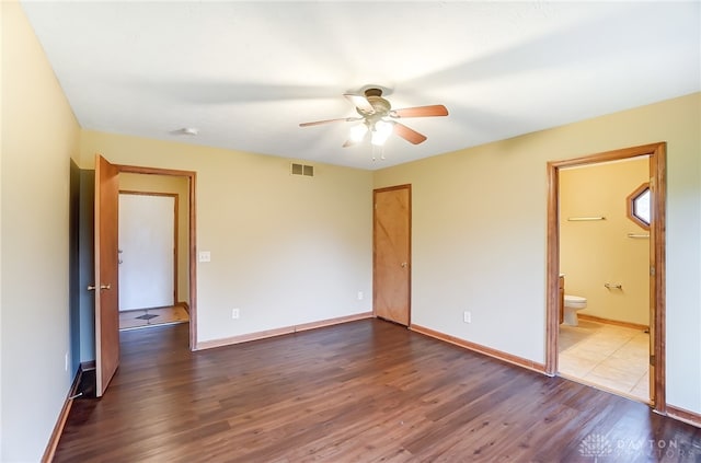 spare room with ceiling fan and dark hardwood / wood-style floors