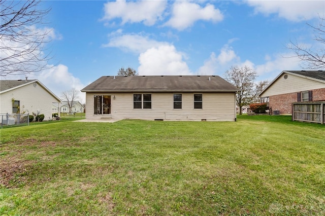 back of house with a yard and a patio area