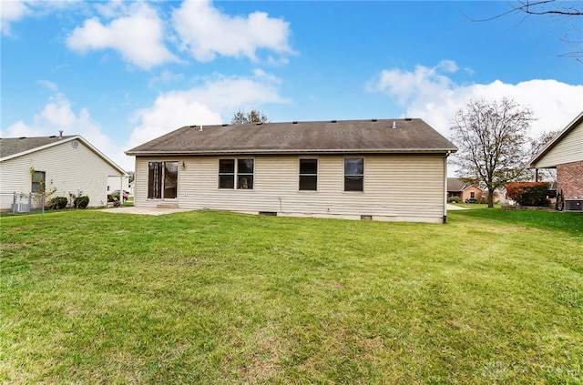 back of house featuring a patio area and a yard