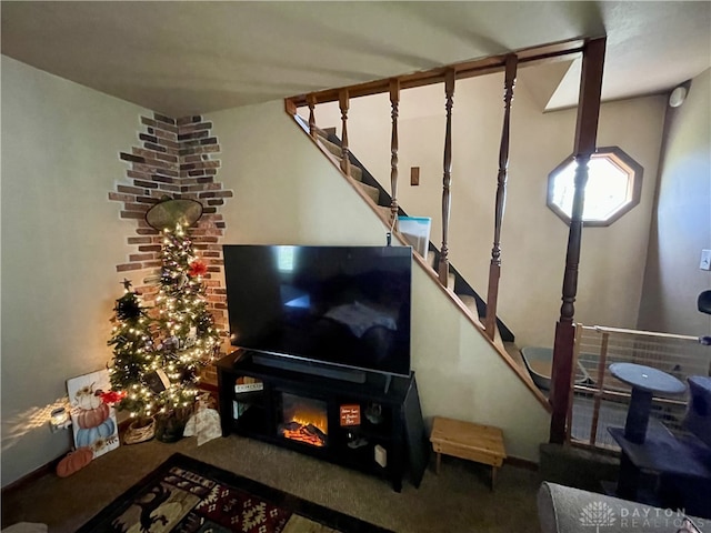 carpeted living room with a fireplace