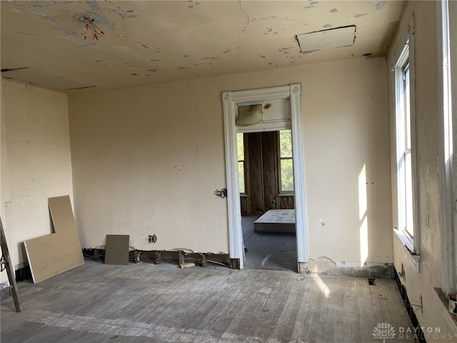 empty room featuring hardwood / wood-style flooring and a healthy amount of sunlight