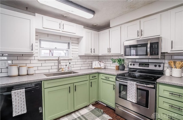 kitchen with white cabinetry, sink, backsplash, stainless steel appliances, and a textured ceiling