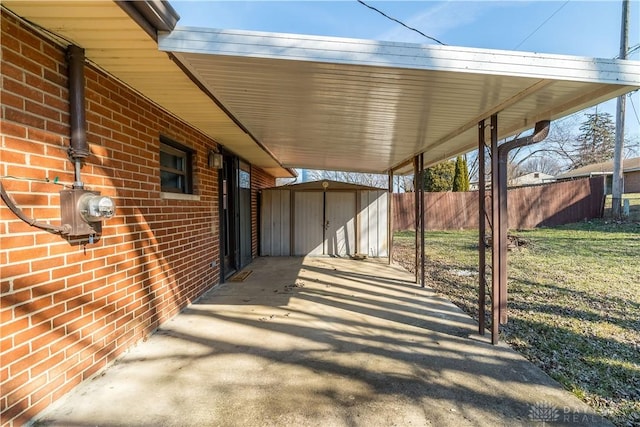 view of patio / terrace with a shed