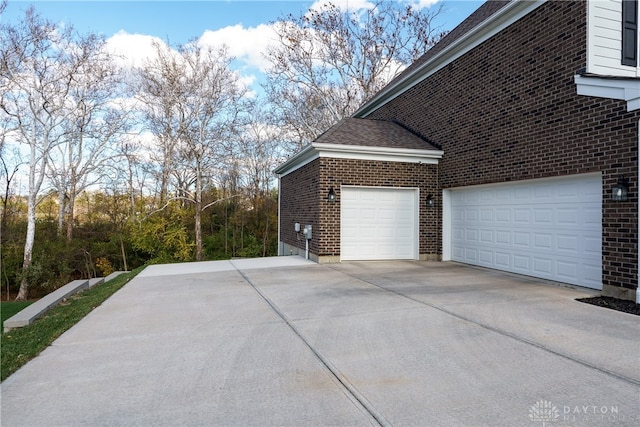 view of side of property featuring a garage