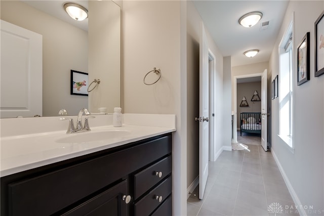 bathroom featuring tile patterned flooring and vanity