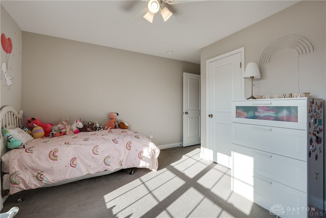 bedroom featuring light carpet and ceiling fan