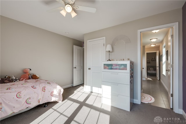 tiled bedroom with ceiling fan