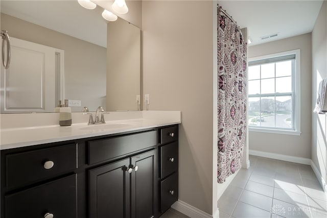 bathroom with vanity and tile patterned floors