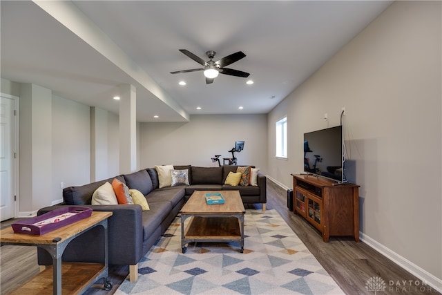 living room with hardwood / wood-style floors and ceiling fan