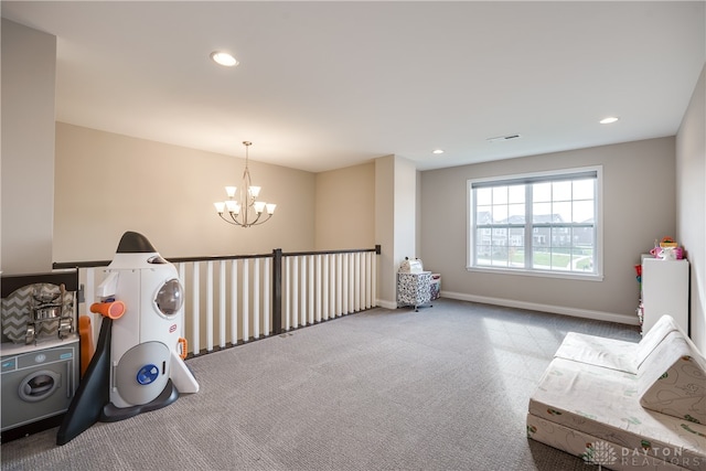 game room featuring light carpet and a notable chandelier