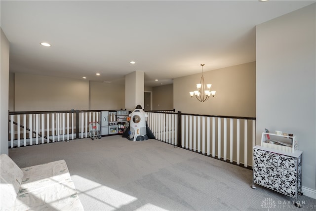 interior space featuring carpet floors and a notable chandelier