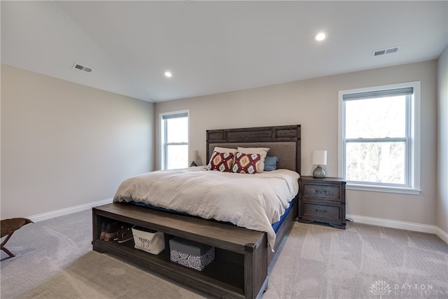 bedroom with light colored carpet