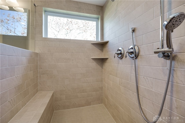 bathroom with tiled shower