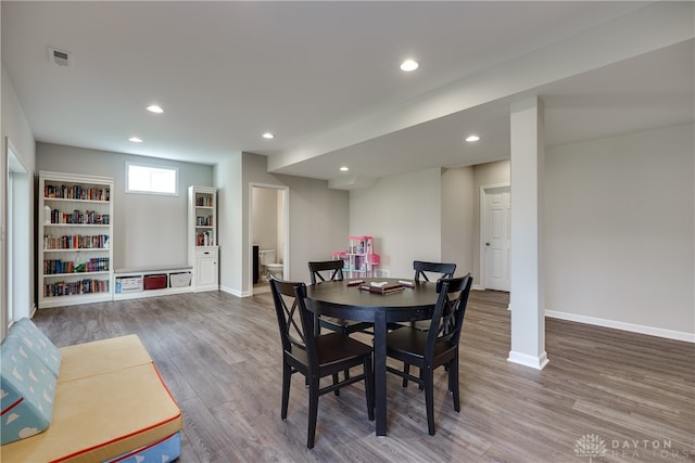 dining area with hardwood / wood-style flooring