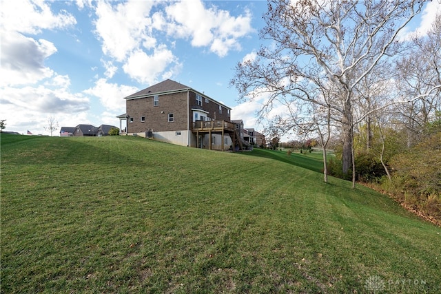 view of yard featuring a wooden deck