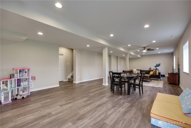 dining room with hardwood / wood-style floors and ceiling fan